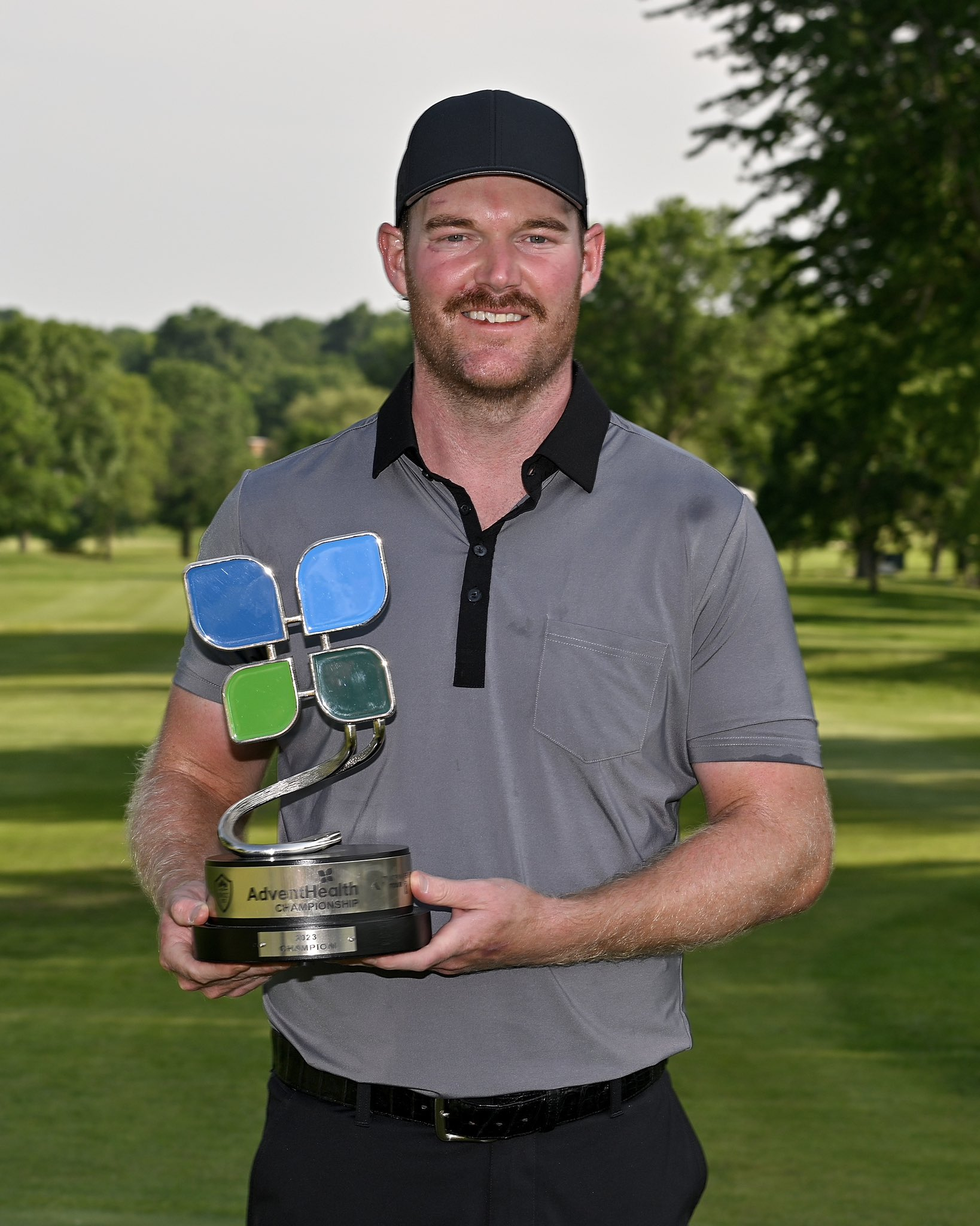 Grayson Murray AdventHealth Championship Winner holding trophy by Malcolm DeMille